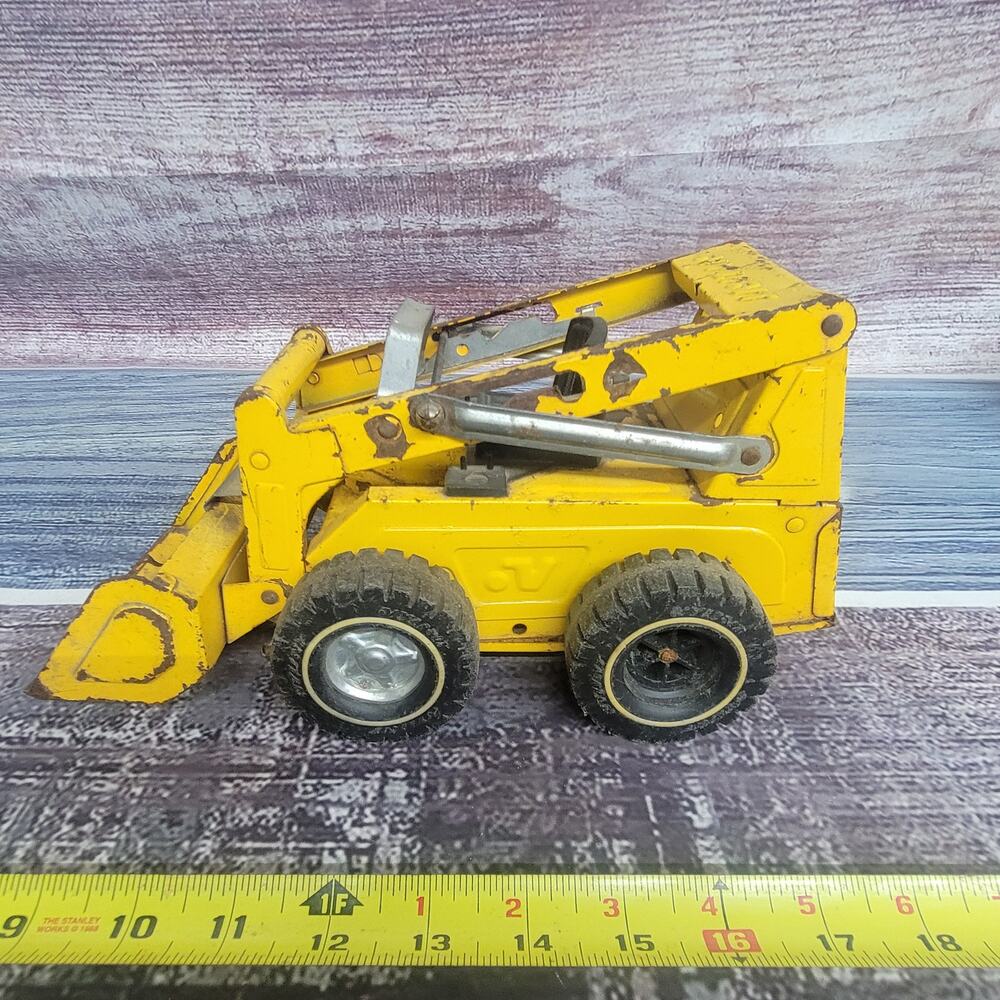 Vintage Nylint pressed steel skid steer parts/repair yellow/black